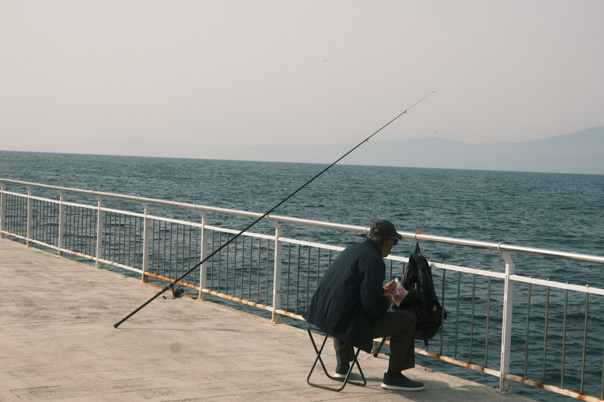 Angler fishing from a pier -- Werribee South Pier fishing guide